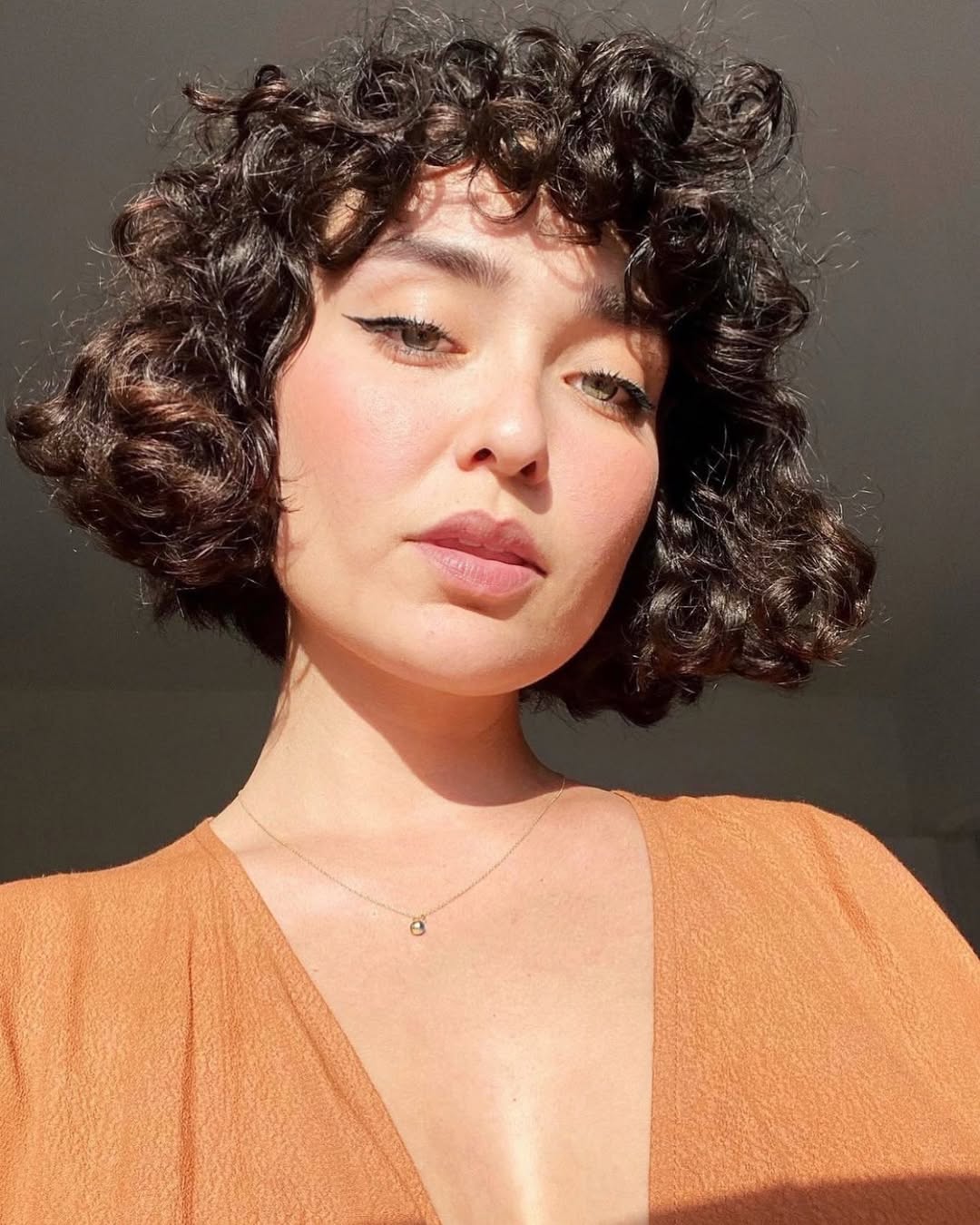 Side-Parted Bob with Defined Curls