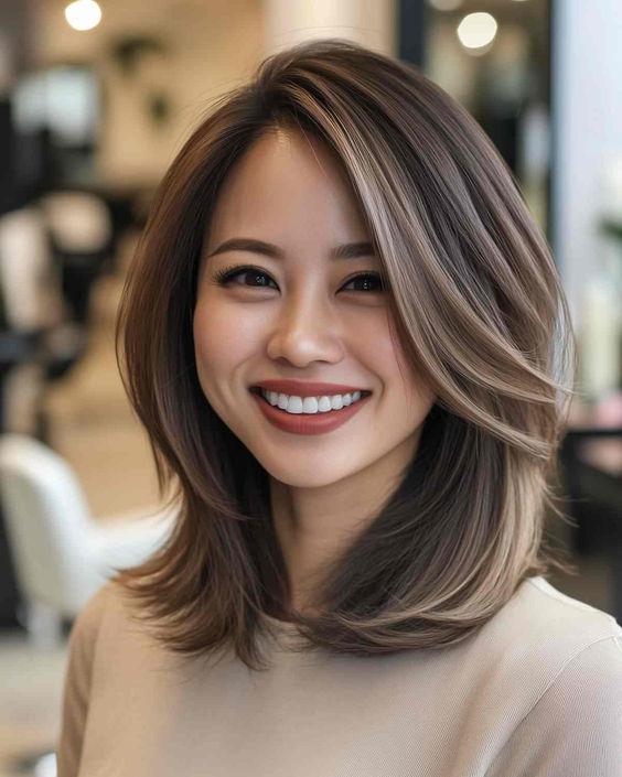 A shoulder-length layered bob gives your hair movement and fullness, perfect for adding dimensio