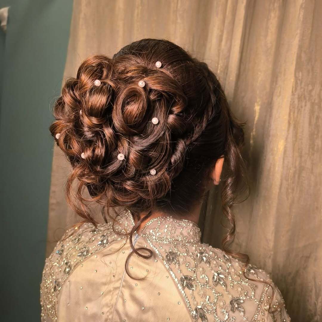 High Messy Bun with Pearls and Vines