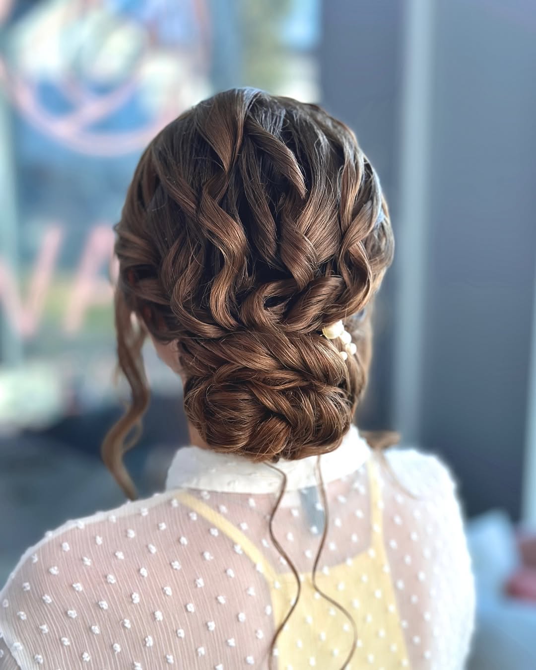Tousled Low Messy Bun with Braids